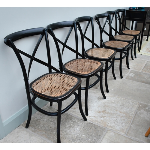 379 - A set of fourteen black bentwood dining chairs with caned seats (two seatpads slightly different) (1... 