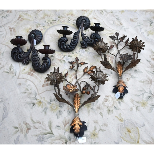 380 - Two pairs of metal wall candle sconces, one pair with branch and leaf design, 56cm, and another pair... 