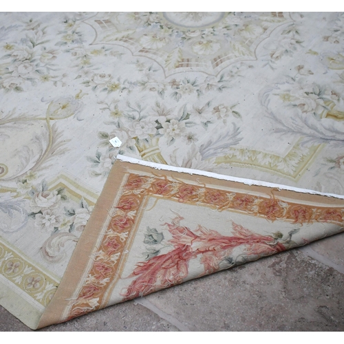 396 - A Large Aubusson style rug, in shades of yellow and grey, 313 x 239cm