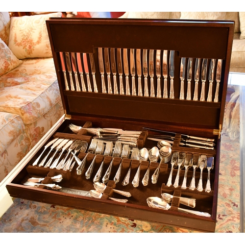 439 - An extensive set of silver plate cutlery in mahogany case inset with tooled leather