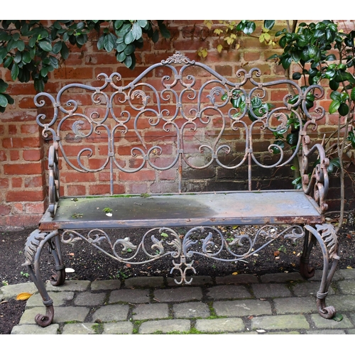 531 - An ornate metal garden seat, 130 wide x 61 x 111cm