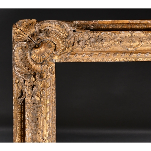 282 - 18th Century French School. A Fine Carved Giltwood Frame, with swept corners, rebate 69