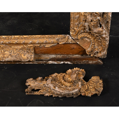 282 - 18th Century French School. A Fine Carved Giltwood Frame, with swept corners, rebate 69