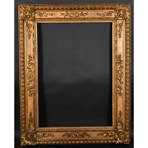 310 - 19th Century Italian School. A Carved Giltwood Frame, with panel decoration and carved cherub corner... 