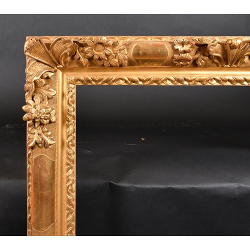 326 - 19th Century French School. A Louis Style Carved Giltwood Frame, with swept centres and corners, reb... 