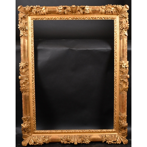 326 - 19th Century French School. A Louis Style Carved Giltwood Frame, with swept centres and corners, reb... 