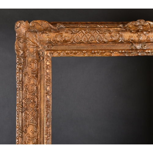 328 - 18th Century French School. A Louis X1V Carved Giltwood Frame with swept centres and corners, rebate... 