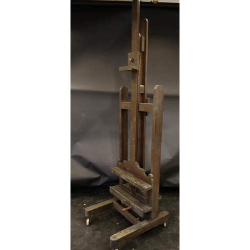 478 - 20th Century English School. A Double sided fully adjustable easel with handle, 66