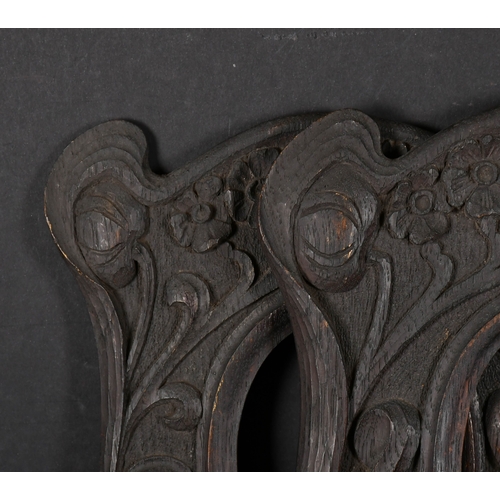 495 - Early 20th Century English School. A Near Pair of Oval Carved Wood Frames, rebate 5.5