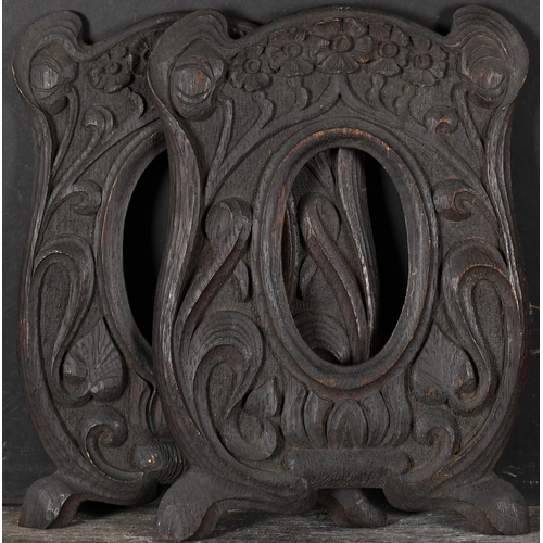 495 - Early 20th Century English School. A Near Pair of Oval Carved Wood Frames, rebate 5.5