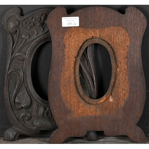495 - Early 20th Century English School. A Near Pair of Oval Carved Wood Frames, rebate 5.5