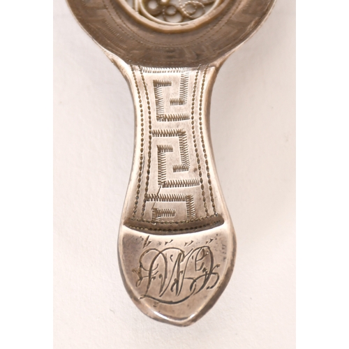 313 - A Georgian Caddy Spoon, with filigree bowl and bright-cut engraved, initials engraved to thumbpiece ... 