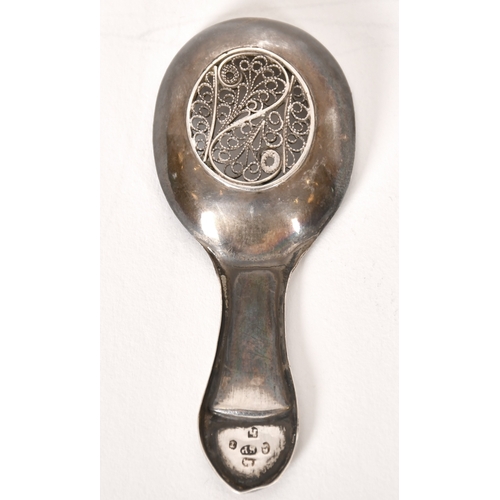 313 - A Georgian Caddy Spoon, with filigree bowl and bright-cut engraved, initials engraved to thumbpiece ... 