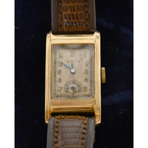 335 - Rolex - A 9ct Gold Wristwatch, Swiss Made, rectangular cream dial with Arabic numberals, subsidary d... 