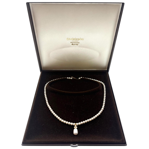 346 - A Single Row Cultured Pearl and Diamond Necklace, slightly graduated, measuring 4- 4.4 mm approx., s... 