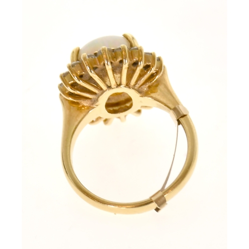 352 - An 18ct Gold Opal and Diamond Cluster Ring, four claw set with a cabochon opal measuring 15.4mm x 11... 