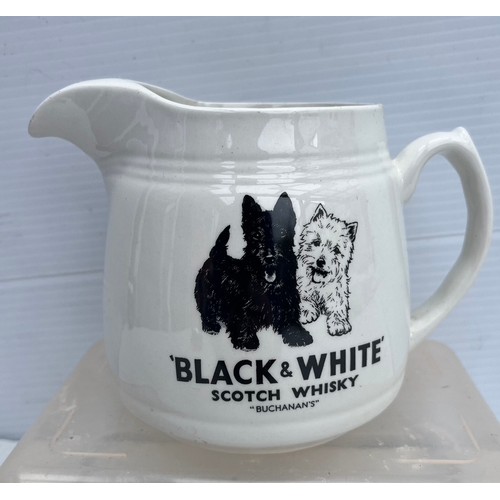 181 - ARKLOW POTTERY BLACK AND WHITE WHISKY JUSG IN GOOD CONDITION NO DAMAGE OR REPAIRS
