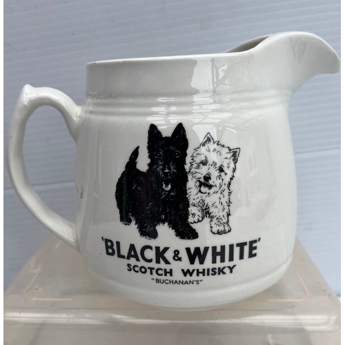 181 - ARKLOW POTTERY BLACK AND WHITE WHISKY JUSG IN GOOD CONDITION NO DAMAGE OR REPAIRS