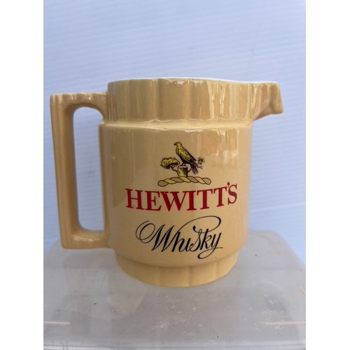 196 - ARKLOW POTTERY JUG FOR HEWIITS WHISKY IN GOOD CONIDTION NO DAMAGE