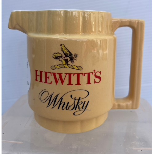 196 - ARKLOW POTTERY JUG FOR HEWIITS WHISKY IN GOOD CONIDTION NO DAMAGE