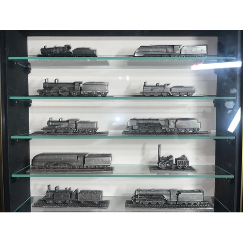 460 - Royal Hampshire pewter trains x 18 in display caninet