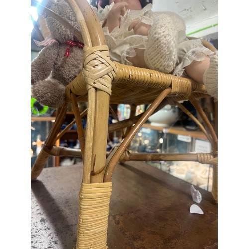 489 - childs wicker chair and pot doll