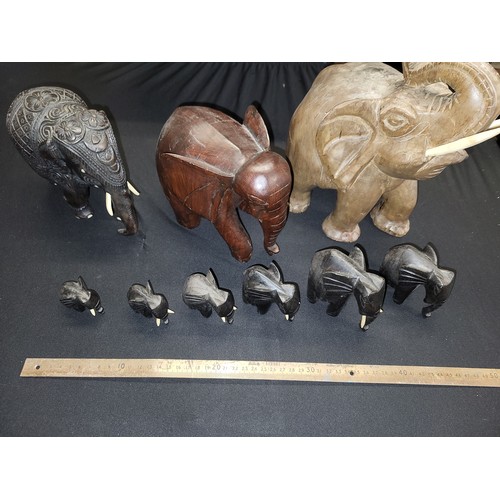 344 - carved wooden elephants x 9