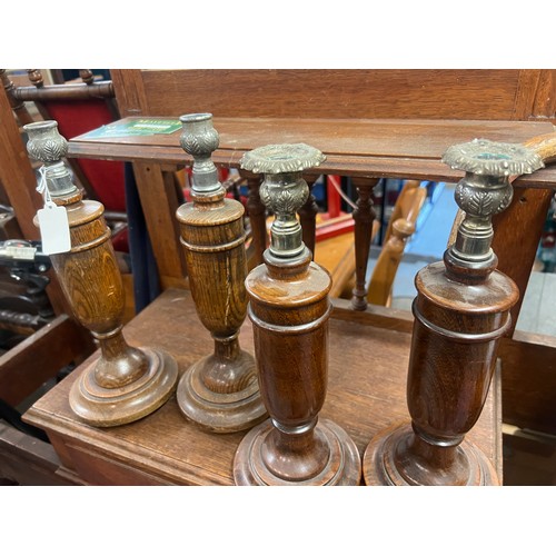 378 - 2 pairs of wooden candlesticks