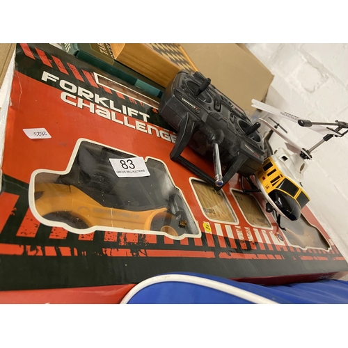 83 - BOXED RADIO CONTROLLED 'FORKLIFT CHALLENGE' & HELLICOPTER