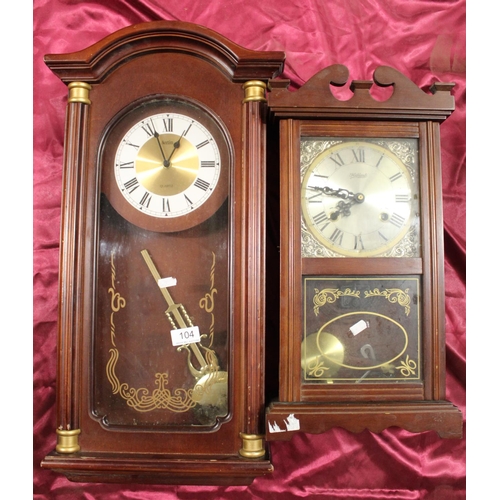 104 - 2 WOOD CASED CLOCKS (WITH PENDULUM)