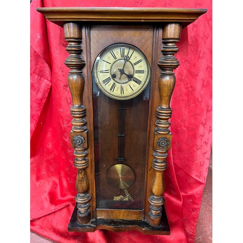 4 - EDWARDIAN CASED ENAMEL FACED 2-HOLE WALL CLOCK (WITH KEY & PENDULUM)