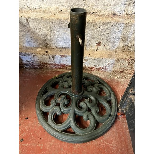 104 - CAST IRON PARASOL STAND