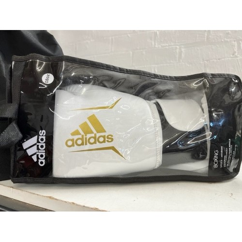 64 - CASED ADIDAS BOXING GLOVES(NEW)