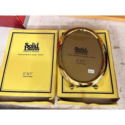 61 - 2 BOXED BRASS PHOTO FRAMES