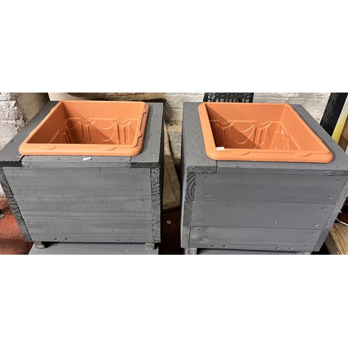 106 - 2 WOODEN PLANTERS WITH INSERTS