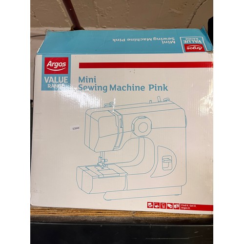 31 - BOXED PINK MINI SEWING MACHINE