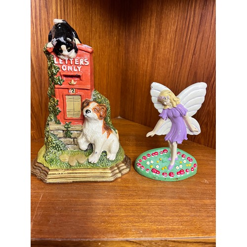 219 - CAST IRON 'DOG' DOORSTOP & A 'FAIRY' DOORSTOP