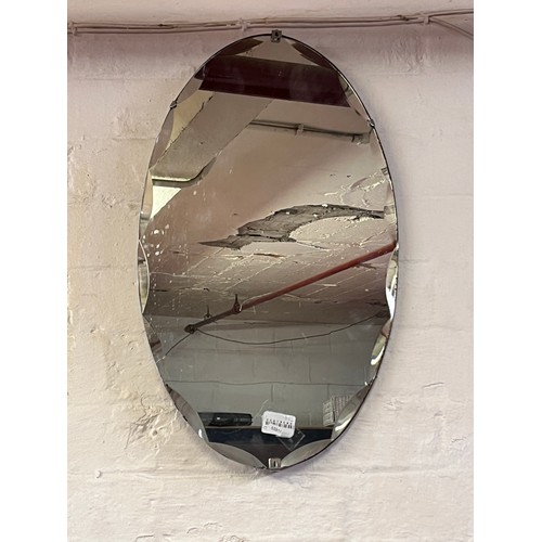 23 - OVAL FRAMELESS BEVELLED EDGE WALL MIRROR