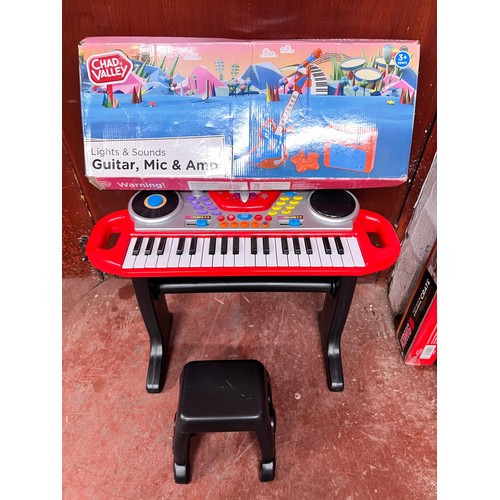 12A - BOXED CHILD'S GUITAR MIC, AMP, KEYBOARD & SEAT (GWO)