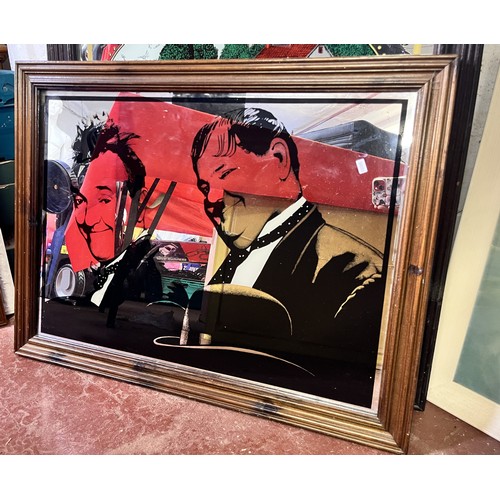 43 - LARGE FRAMED MIRRORED LAUREL & HARDY DEPICTION