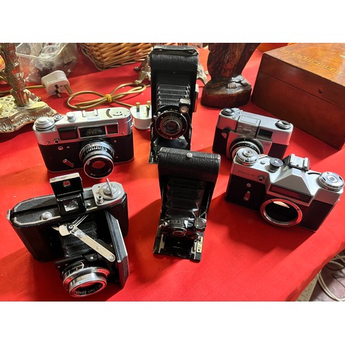 299 - 6 VINTAGE FOLDING CAMERAS