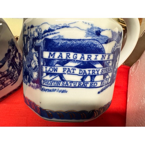 312 - 2 BLUE & WHITE POTTERY 'BEST BUTTER' JUGS