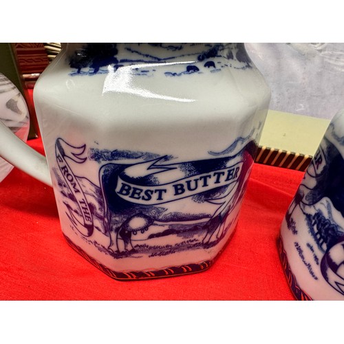 312 - 2 BLUE & WHITE POTTERY 'BEST BUTTER' JUGS