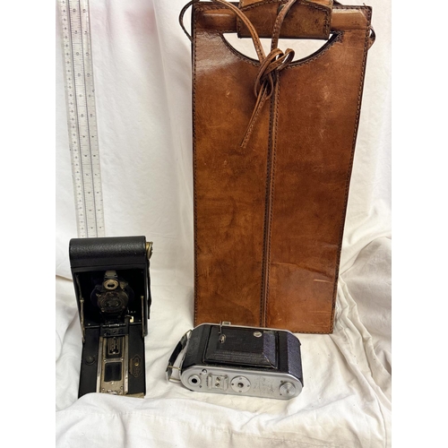 157 - LEATHER TWO-BOTTLE CARRIER & 2 VINTAGE CAMERAS