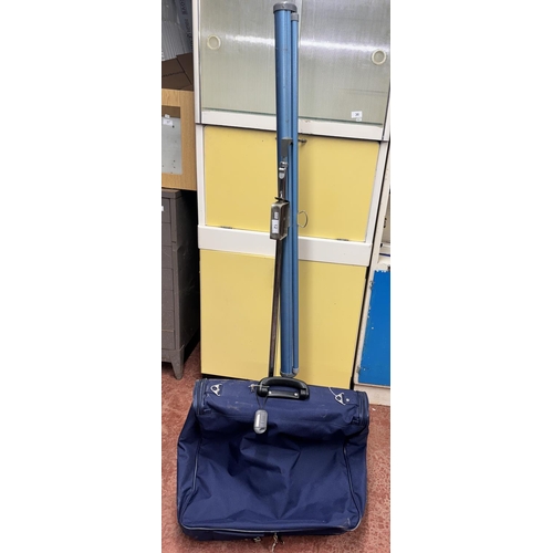 12 - PROJECTOR SCREEN & A FIORE SUIT CARRIER