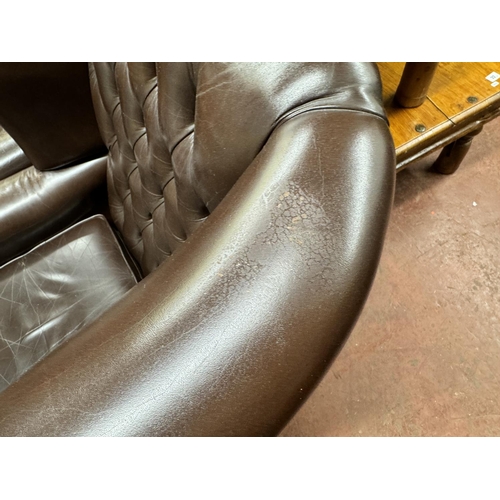 29A - 2 DEEP BUTTONED BROWN LEATHER CHESTERFIELD ARMCHAIR & MATCHING FOOTSTOOL