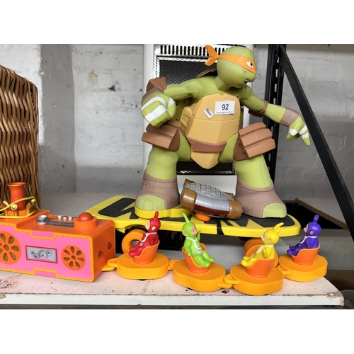 92 - REMOTE CONTROL NINJA TURTLE & A TELETUBBIES TRAIN