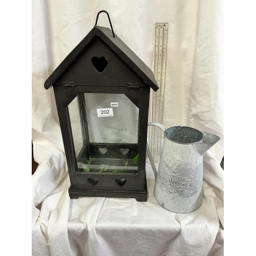 202 - LARGE BLACK WOODEN CANDLE LANTERN & METAL DECORATIVE JUG