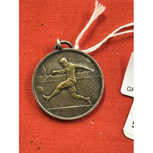 215 - 1950'S SILVER FOOTBALL MEDAL