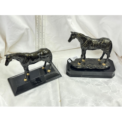 209 - PAIR OF RESIN HORSE FIGURES ON PLINTHS